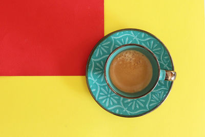 Directly above shot of coffee cup on table