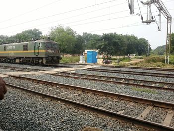 Train on railway tracks against sky