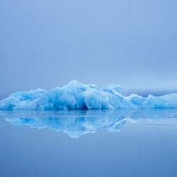 View of iceberg against sky