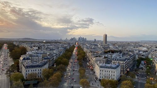 High angle view of city street and buildings against sky