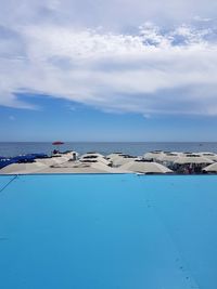 Scenic view of sea against blue sky