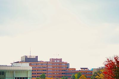 Buildings in city against sky