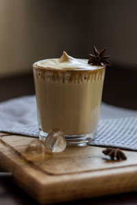 A glass of the popular trendy drink dalgona coffee with milk. whisk and ice. high quality photo