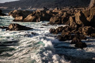 Scenic view of rocks in sea