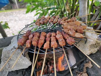 High angle view of meat on barbecue grill