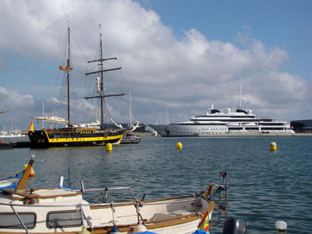 Boats moored at harbor