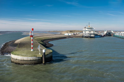 Ferry terminal on the dutch tourist island texel against blue sky