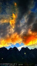 Scenic view of mountains against sky at sunset
