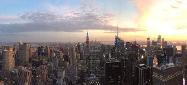 Aerial view of city buildings during sunset