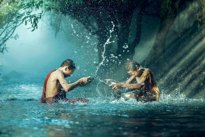 People enjoying in swimming pool