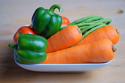 High angle view of vegetables in plate on table