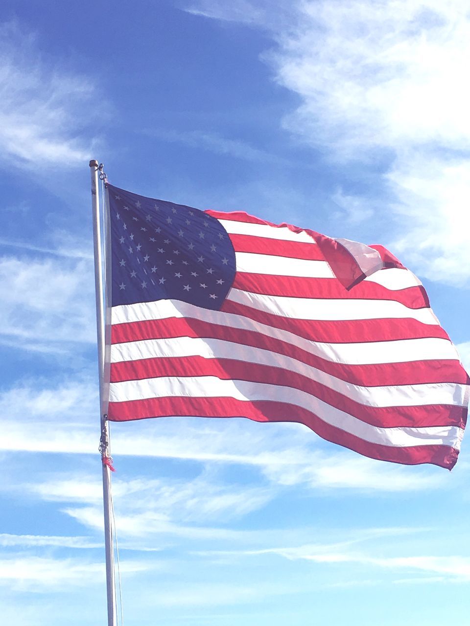 flag, patriotism, striped, stars and stripes, flag pole, sky, low angle view, no people, cloud - sky, day, outdoors, close-up