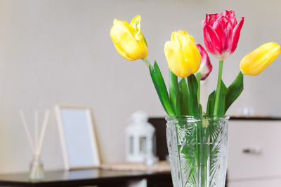 Close-up of tulips in vase on table