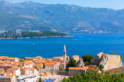 Budva montenegro old town and central beach . medieval walled city with coastal view 