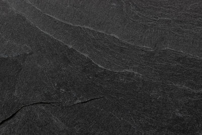 Dark grey black slate background or texture.