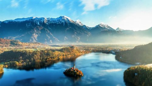 Scenic view of lake and mountains against sky