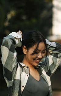 Portrait of young woman looking away