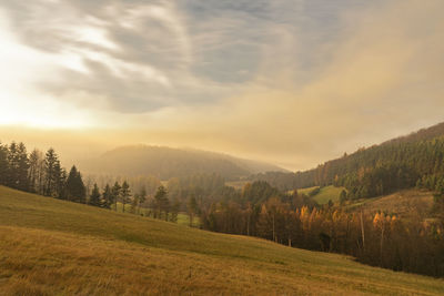 Scenic view of landscape against sky during sunset