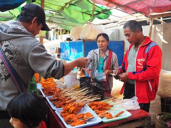 People at market stall