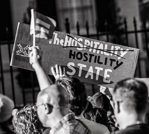 People protesting with banner in city