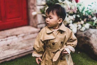 Cute boy standing outdoors