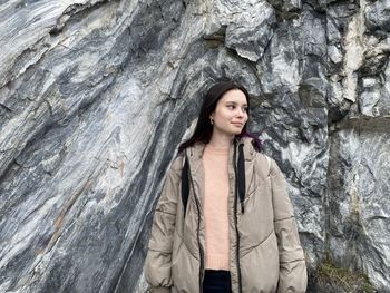 Portrait of woman standing on rock