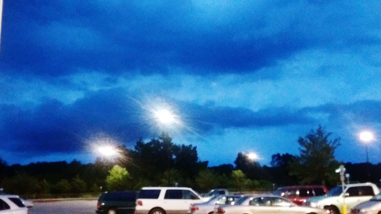 VIEW OF PARKING LOT AGAINST CLOUDY SKY