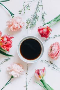 Directly above shot of flowers and coffee