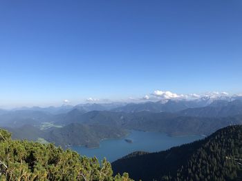 Scenic view of mountains against clear blue sky