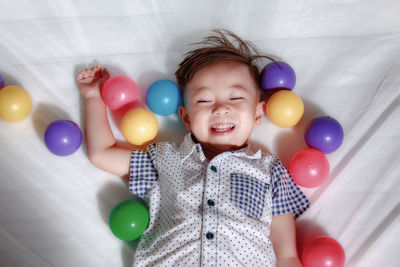 Boy playing with balloons