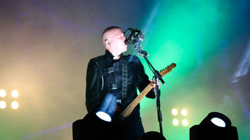 Full length of man playing guitar