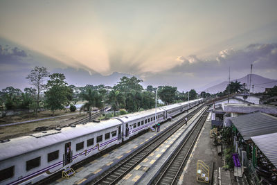 High angle view of train at railroad station against sky