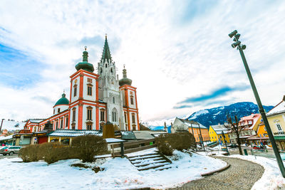 Traditional building against sky during winter