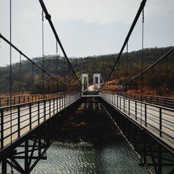 Bridge over river against sky