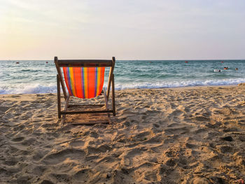 Scenic view of beach against sky during sunset