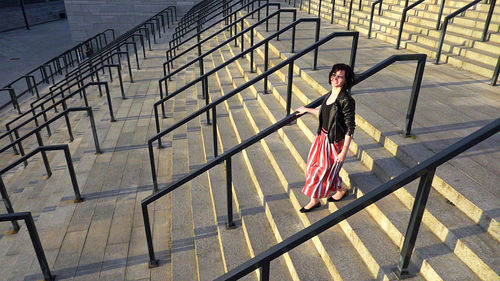 Portrait of woman on railing