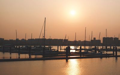 View of harbor at sunset