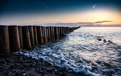 Scenic view of calm sea at sunset
