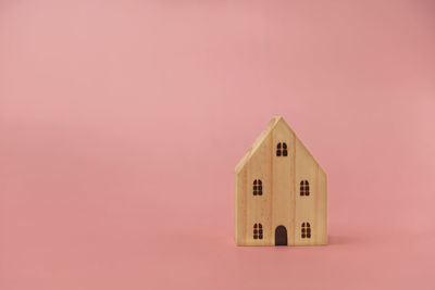 Close-up of pink toy against building