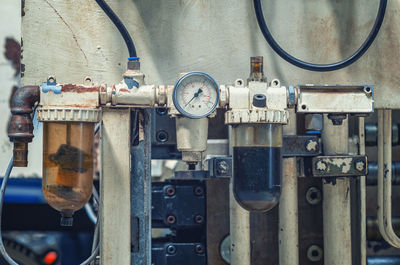 Manometer on industrial equipment. large industrial equipment at plant, pressure in the pipes