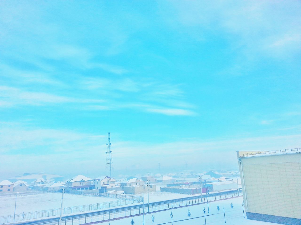 snow, winter, built structure, cold temperature, sky, architecture, building exterior, blue, weather, connection, cloud - sky, season, communication, day, outdoors, technology, copy space, no people, nature, electricity