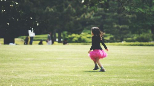 Woman walking on field