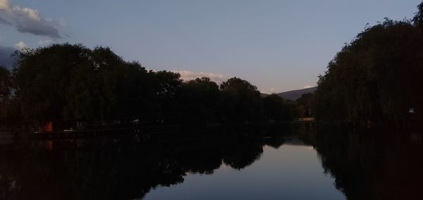 Scenic view of lake against sky during sunset