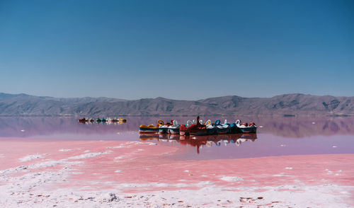 Scenic view of desert against clear blue sky