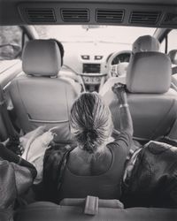 Rear view of people sitting in bus