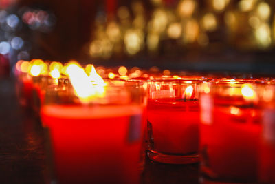 Close-up of tea light candles on table