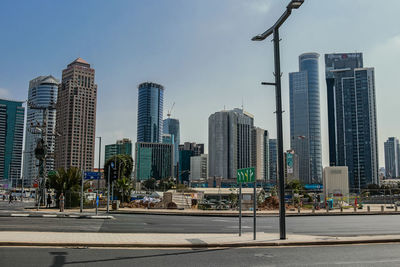 Modern buildings in city against clear sky