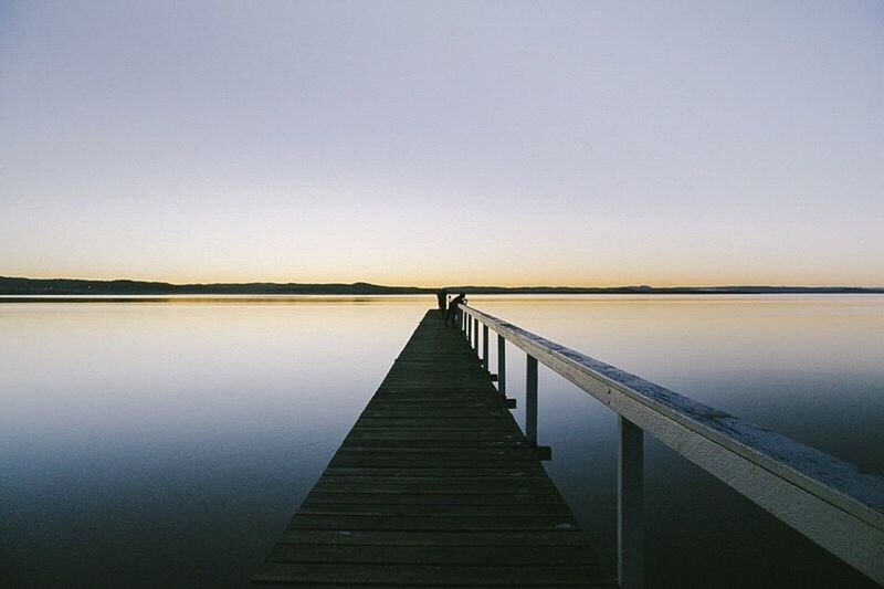 PIER ON LAKE AGAINST CLEAR SKY