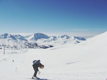 Tourists on snow covered landscape