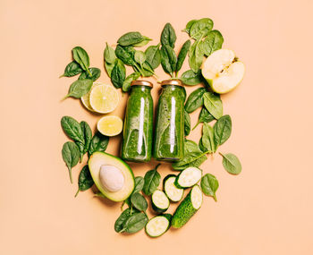 Directly above shot of vegetables against pink background